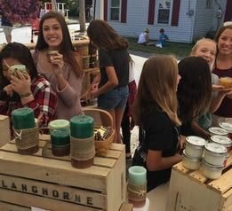 People shopping for candles
